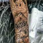 tatuagem tio patinhas no braço